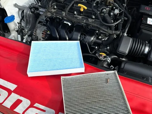 New cabin filter beside the clogged filter removed during a mobile service