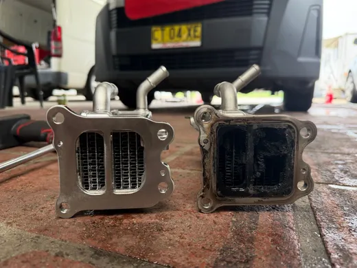 New EGR cooler next to the carbon-blocked cooler removed from a vehicle