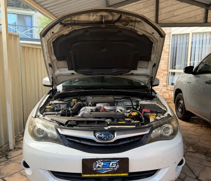 RSG Mechanical attending a Subaru at a customer home, bonnet raised