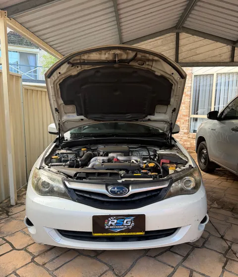 RSG Mechanical servicing a Subaru at a customer's home
