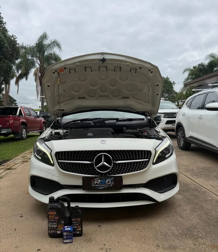RSG Mechanical servicing a Mercedes-Benz on site, RSG plate cover on the grille