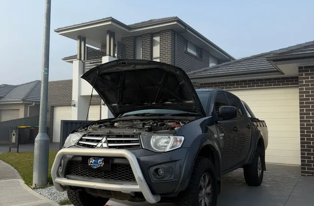 Ute on ramps being repaired in a customer driveway in Sydney
