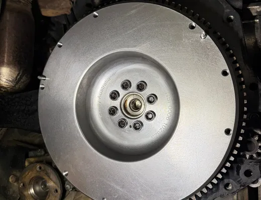 New flywheel installed during a clutch replacement